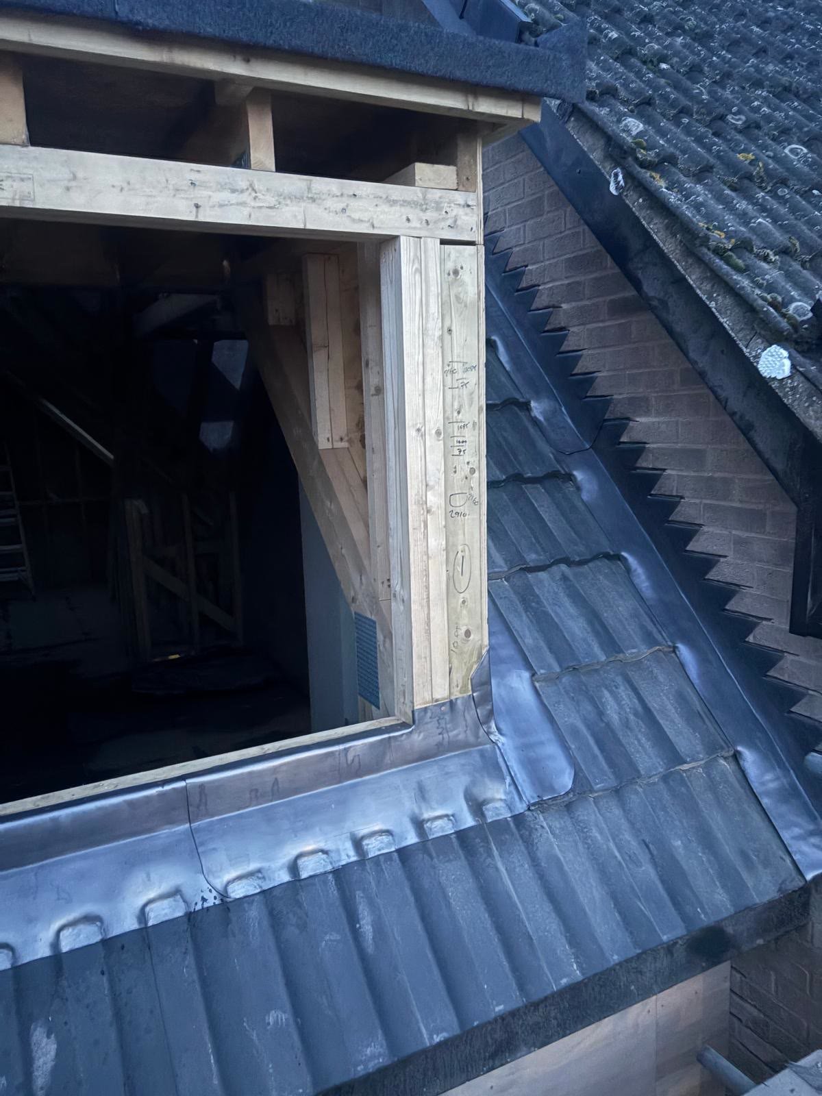 Lead soakers and flashing around a dormer