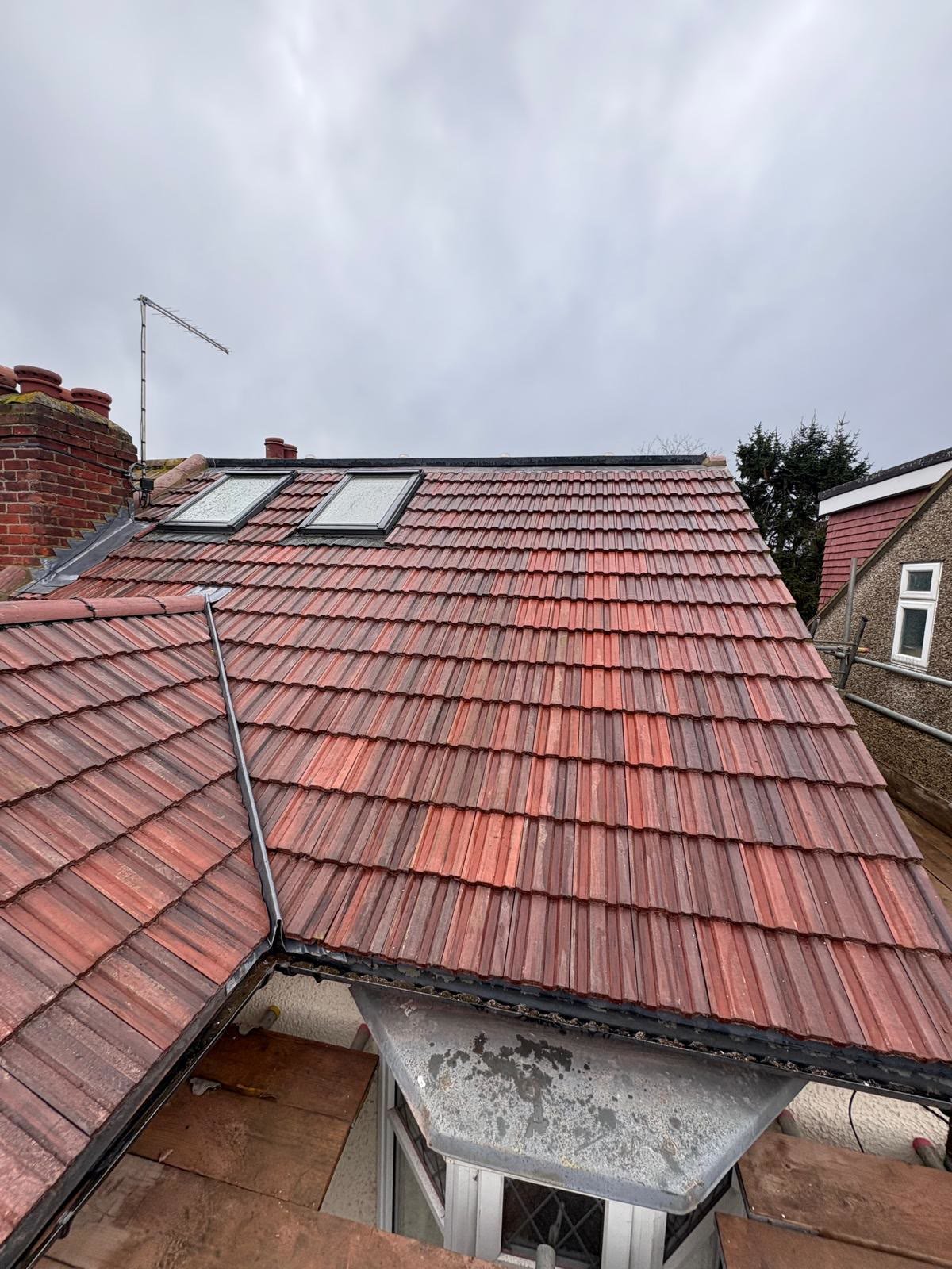 New red tiled roof with two roof windows